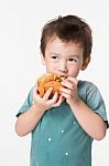 Boy Eating A Burger Stock Photo