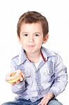 Boy Eating A Donut Stock Photo