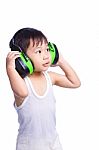 Boy In A White Singlet Wearing Earmuffs Stock Photo