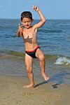 Boy On The Beach Stock Photo