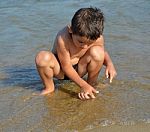 Boy On The Beach Stock Photo