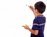 Boy Painting On Blank Board Stock Photo