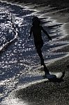 Boy Running On A Beach Stock Photo