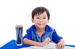 Boy Smiling And Drawing Stock Photo