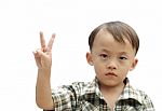 Boy With Victory Hand Sign Stock Photo