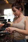 Brunette In Kitchen With Coffee Maker Stock Photo