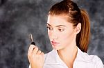 Brunette Looking At A Key Stock Photo