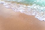 Bubble Of Sea Wave On Sand Stock Photo