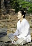 Buddhist Woman Meditating Stock Photo