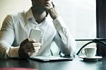 Businesman With Smartphone In Cafe Stock Photo