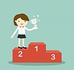 Business Concept, Business Woman Standing On 2nd Winning Podium And Holding Silver Trophy Stock Photo