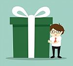 Business Concept, Businessman Holding A Big Gift Box For Christmas Festival Stock Photo