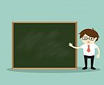 Business Concept, Businessman Standing In Front Of Green Chalkboard For Presentation Stock Photo