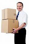 Business Executive Holding A Boxes Stock Photo