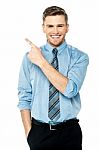 Business Executive Pointing Away Stock Photo