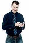 Business Executive Using His Cell Phone Stock Photo