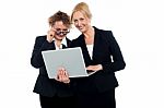 Business Friends Enjoying Video On Laptop Stock Photo