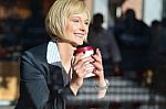 Business Lady Enjoying Her Refreshment Stock Photo