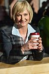 Business Lady Enjoying Her Refreshment Stock Photo