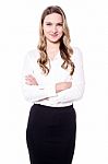 Business Lady Posing With Folded Arms Stock Photo