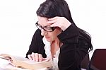 Business Lady Reads Book In Office Stock Photo