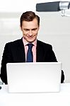 Business Male Watching Videos On Laptop Stock Photo