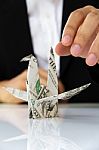 Business Man Hand Holding Origami Paper Cranes Stock Photo