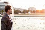 Business Man In Front Of A Fountain Stock Photo