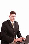 Business Man On Laptop In Office Stock Photo