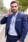 Business Man On The Street And Mobile Phone Stock Photo