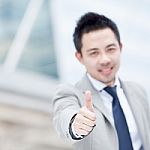 Business Man Show Thumb Up Stock Photo