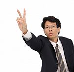 Business Man Showing Victory Hand Focus At Finger On White Background Stock Photo