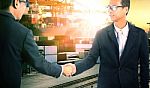 Business Man Successful Shake Hand With Joint Venture Corperation In Commercial Shipping Import Export Trading Stock Photo