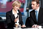 Business People Having Discussion At Cafe Stock Photo