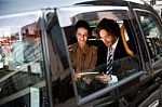 Business People In Taxi Cab Stock Photo