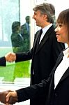 Business People Shaking Hands Stock Photo