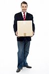 Business Representative Holding Cardboard Box Stock Photo