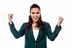 Business Woman Cheering With Her Arms Raised Stock Photo