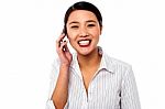 Business Woman Closing Deal Over A Phone Call Stock Photo