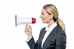 Business Woman Proclaiming Into Megaphone Stock Photo