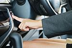 Business Woman Push An Engine Start Button Stock Photo