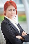 Business Woman Smiling Arms Crossed Stock Photo