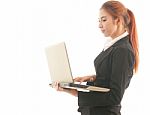 Business Woman Standing Using Laptop Stock Photo