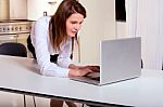 Business Woman With Laptop Kitchen Stock Photo