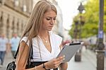 Business Woman With Tablet Computer Walking On Urban Street Stock Photo