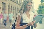 Business Woman With Tablet Computer Walking On Urban Street Stock Photo