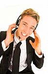 Businessman Adjusting Headset Stock Photo