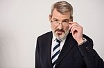 Businessman Adjusting His Glass Stock Photo