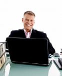 Businessman At Desk with laptop Stock Photo