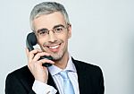 Businessman Attending Phone Call Stock Photo